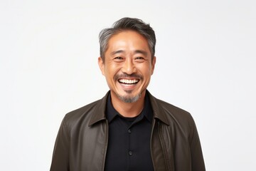 medium shot portrait of a happy Japanese man in his 40s wearing a chic cardigan against a white background