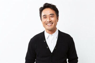medium shot portrait of a happy Japanese man in his 40s wearing a chic cardigan against a white background