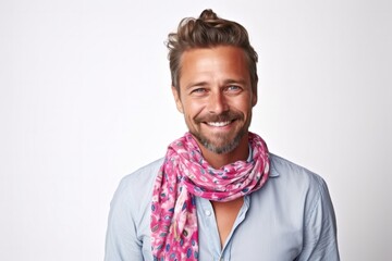 medium shot portrait of a happy Polish man in his 30s wearing a foulard against a white background