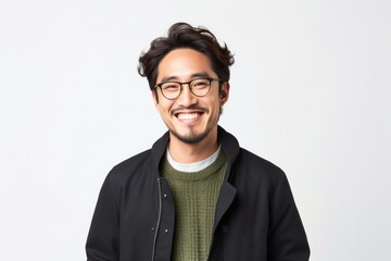 portrait of a happy Japanese man in his 30s wearing a chic cardigan against a white background - obrazy, fototapety, plakaty