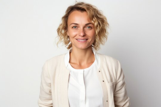 medium shot portrait of a happy Polish woman in her 30s wearing a chic cardigan against a white background