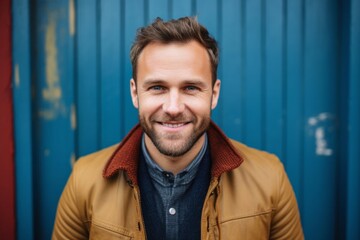 Obraz premium portrait of a happy Polish man in his 30s wearing a chic cardigan against an abstract background