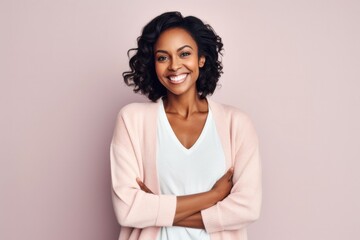 Fototapeta premium medium shot portrait of a Kenyan woman in her 30s wearing a chic cardigan against a pastel or soft colors background