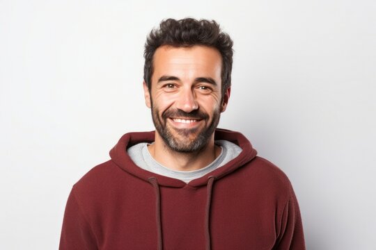 portrait of a Israeli man in his 30s wearing a cozy sweater against a white background