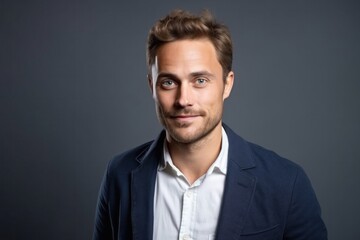 Fototapeta premium medium shot portrait of a Polish man in his 30s wearing a chic cardigan against a white background