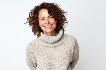 portrait of a Israeli woman in her 40s wearing a cozy sweater against a white background