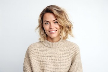 Fototapeta premium medium shot portrait of a Polish woman in her 30s wearing a cozy sweater against a white background