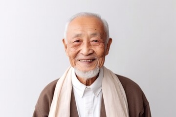 Fototapeta premium medium shot portrait of a confident 100-year-old elderly japanese man wearing a foulard against a minimalist or empty room background