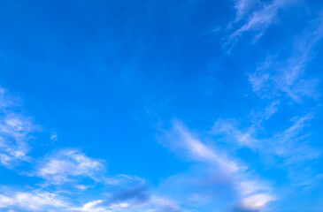 Light pink clouds in the sky during sunset.