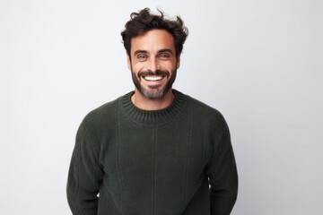 Fototapeta premium medium shot portrait of a confident Israeli man in his 30s wearing a cozy sweater against a white background