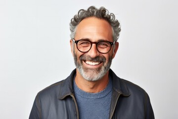 medium shot portrait of a confident Israeli man in his 50s wearing a chic cardigan against a white background - obrazy, fototapety, plakaty