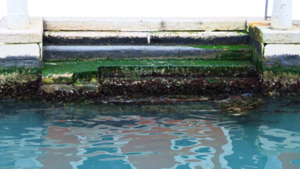 Water canal of stone construction, medieval staircase into water isolated PNG photo with transparent background. High quality cut out scene element. Realistic image overlay