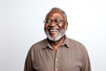 Fototapeta premium portrait of a Kenyan man in his 60s wearing a chic cardigan against a white background