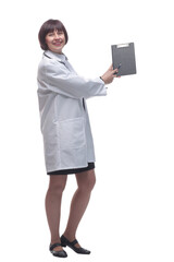 female medic making notes to the clipboard . isolated on a white background.
