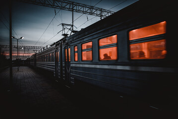 An electric train at evening in winter