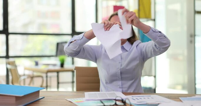 Irritated manager crumples sheets of paper with incorrect project ideas written on them. Angry woman fails at work and has financial and creative crisis
