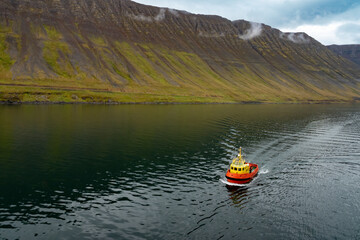 Tugboat near the harbor of Ísafjörður (ice fjord, Vestfirðir (Westfjords), northwest of Iceland.