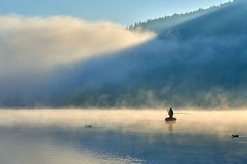 Obraz na płótnie Canvas sunrise on a foggy morning at Lake Titisee, Baden-Württemberg, Germany