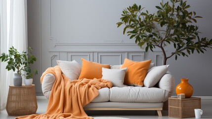 Gray living room with white sofa and orange throw blanket