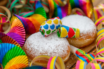 Pancakes (doughnuts) with powdered sugar and party decoration