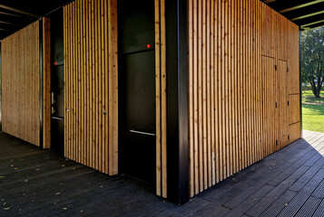 public toilets with LED light signaling when occupied glows red. paid toilets and showers by coin and payment card. changing room for children and women