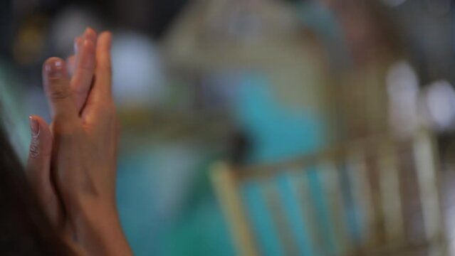 A lady claps at the holiday table