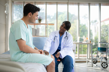 Doctor examining knee joint function of patient in hospital, Medical health care