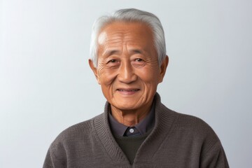 Fototapeta premium Happy Senior Man with Gray Hair Smiling in Studio Portrait