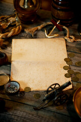 Treasure island concept on a wooden table background. Sheet of paper for text or map. Vertical background	
