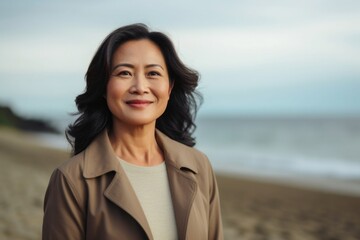 Happiness in nature: Smiling woman with beachside portrait in front view