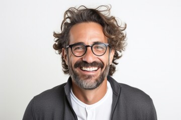 Fototapeta na wymiar Confident smiling man with attractive beard and curly hair on white background