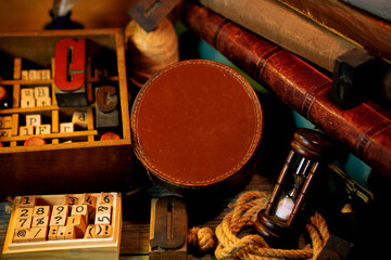 Vintge round box for text, logo on wooden table. Retro type objects and old wooden typographic...