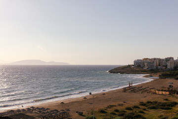 The coast of Rafina in Greece, with a deserted beach just after sunrise.