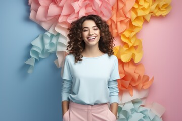 Obraz na płótnie Canvas Attractive woman on a pastel colorful background