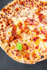 pizza baked in a wood-fired oven, meat, bacon, cheese appetizer meal fast food snack on the table copy space food background rustic top view