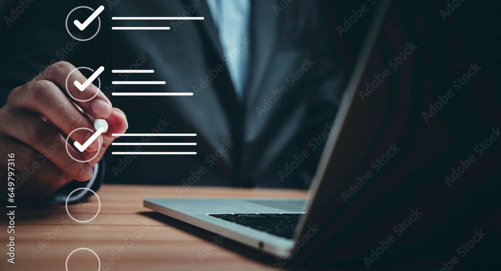 Poster Businessman using laptop computer and touching to online electronic paper for approve ISO quality document control certification and project approval concept.