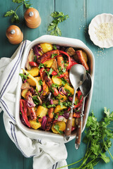 Baked sausage and vegetables, peppers, zucchini, tomatoes, red onion and eggplant with sesame and...