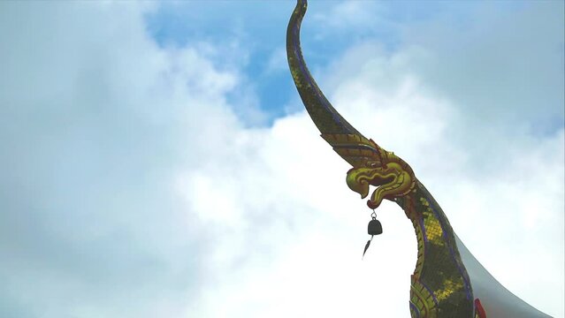 Close up to Cho fa thai language call it, like finial on the roof ridge and heap beautiful white cloud clear blue sky huge rollong in the rainy season time lapse