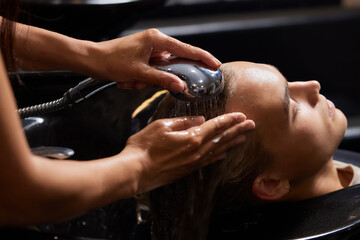 Airtouch Hair stylist makes bouffant using comb on thin strands. Shatush technique for hair...