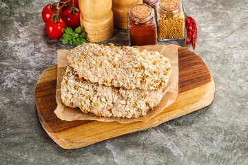 Breaded raw breaded meat schnitzel