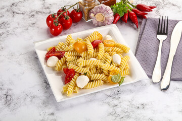 Italian pasta with mozzarella and tomato