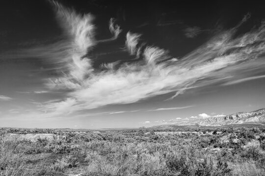 Classic black and white monochrome image of cloudscape and high desert landscape of western Colorado. 