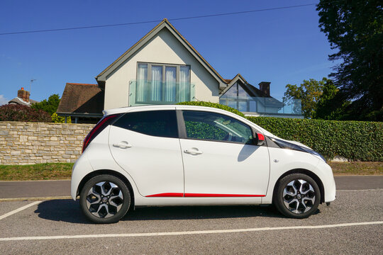 Fareham England 14 September 2023 - A white Toyota Aygo viewed side on. Small trendy car