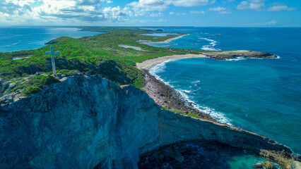 Aerial View to the Green Coast of the Pointe des Chateaux beach under the blue cloudy sky, Guadeloupe island