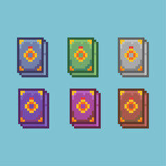 Pixel art sets of magic books ring with variation color item asset. simple bits of book of rings on pixelated style 8bits perfect for game asset or design asset element for your game design asset