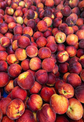 Lots of organically grown peaches in the city market.