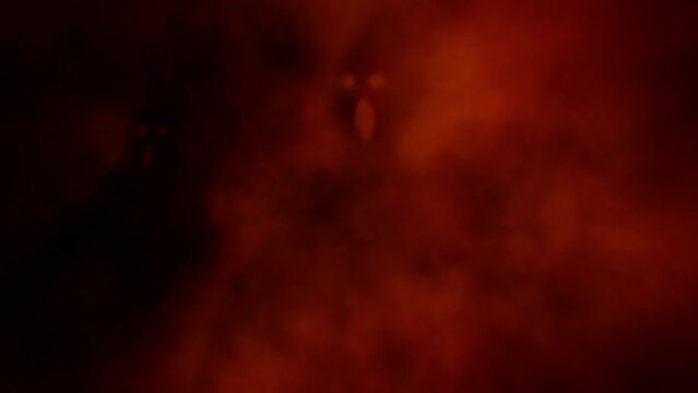 Two screaming ghosts emerge from fog and look with glowing eyes. Creepy 2D animation. Horror fantasy genre. Gloomy characters from nightmares. Coal and noise effect. Red and black background colors.