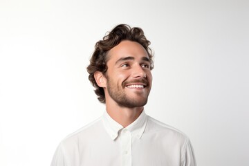 Close up head shot confident handsome smiling young man in white shirt looking aside, isolated on grey white studio background. Studio portrait of happy millennial guy with beard and brown hair.