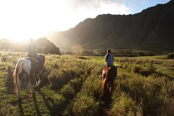 Ingelijste posters Riding at Kualo Aranch Park in Hawaii, where the sun sets © Jimmy