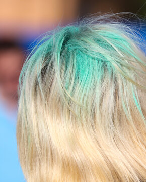 Girl's hair in multi-colored paint